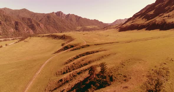 Aerial Rural Mountain Road and Meadow at Sunny Summer Morning. Asphalt Highway and River alt