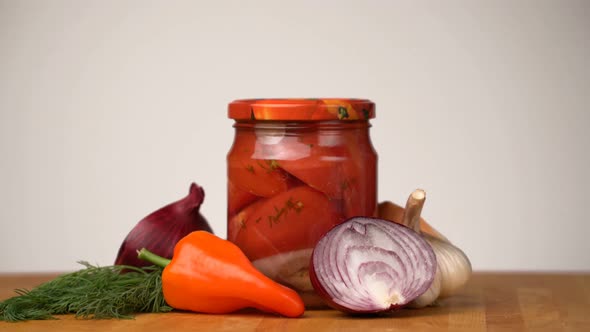Footage Glass Jars with Salted Vegetables for the Winter Rotated on Table. alt
