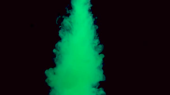 Real Shot Green Paint in the Water in Slow Motion. Ink Swirling Underwater. Cloud of Ink Collision alt