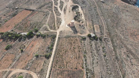 Aerial drone video from northern Malta near the Ghajn Znuber Tower. alt