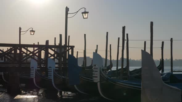 Scene of Venice Dock with Gondolas Moored Near the Pier alt