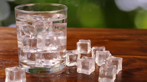 Glass with Alcoholic Drink and Ice Cubes