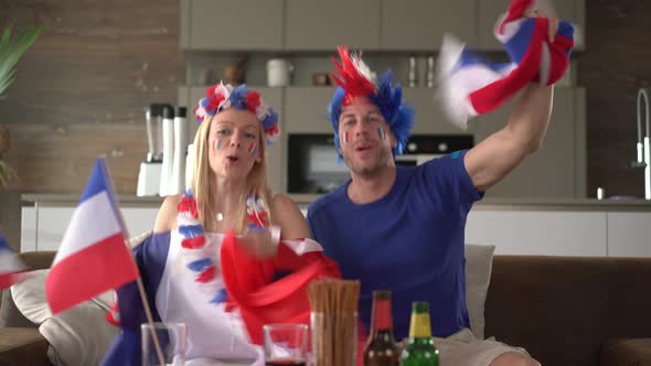Happy French Fan Couple Cheering for France