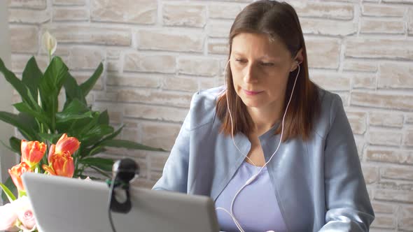 Business woman typing on laptop computer working at home using  internet.