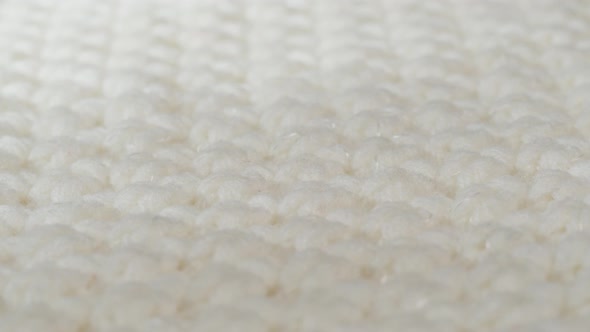 White Knitted Cloth Light Woolen Clothes Fabric Closeup Woven Textile Background alt