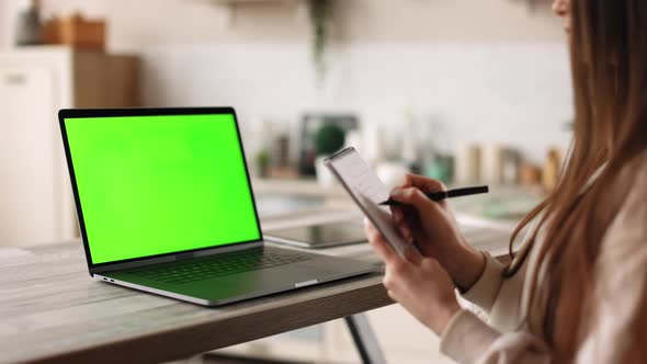 A Woman is Sitting in Her Home Office alt