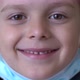 A Child in a Medical Mask Winks - VideoHive Item for Sale