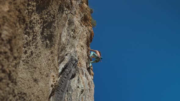 Young Powerful Athletic Man Rock Climber With Long Hair Climbing On Overhanging Cliff Stock Footage