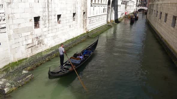 Gondolas Going in Canals in Venice Italy alt