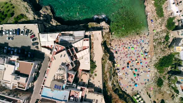 Aerial View of Lama Monachile Beach in Italian City of Polignano a Mare alt