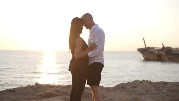 Loving Couple Dancing in Slow Motion in Sunrays at Mediterranean Sea Sunset alt