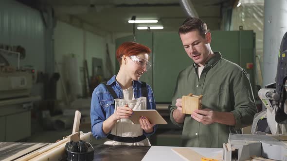 Joiners Coworkers Work on Making Wooden Chair Stool Engaged in Woodworking Together