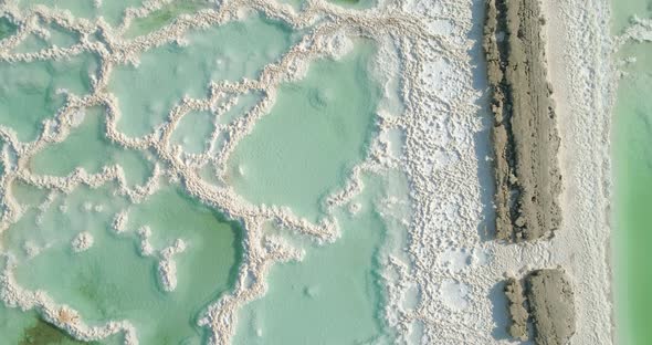 Aerial view of colourful sinkholes. The Dead sea, Negev, Israel. alt