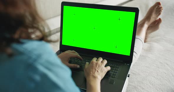 Woman with Laptop Chromakey on Sofa