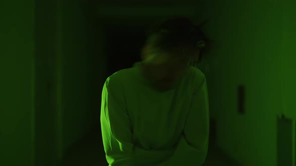 A Mad Male Patient in Straitjacket is Going Crazy in a Mental Hospital alt