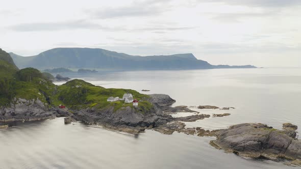 Panorama Of Skongenes Lighthouse On The Tip Of Vagsoy Island In Norway. - aerial alt