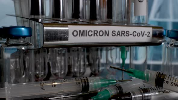 Putting test tubes into rack labelled as Omicron, after specimen collection. Close Up alt