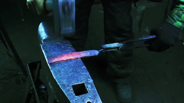 Blacksmith Forging a Knife
