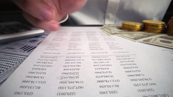 Accountant analyzing business marketing data on paper dashboard at office table. alt