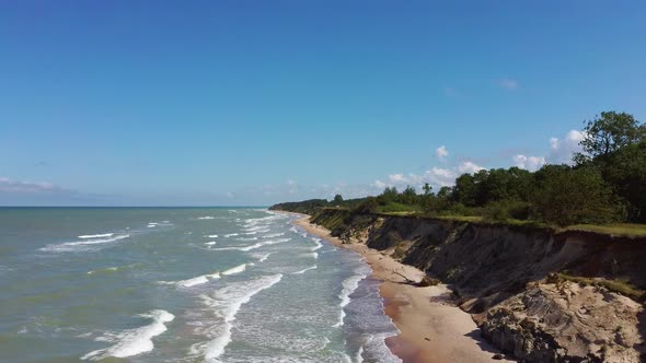Flying Over Coastline Baltic Sea Ulmale Seashore Bluffs Near Pavilosta, Latvia and Landslides With a alt