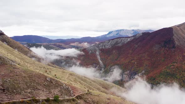 Flying Over Mountain Ranges with Cliffs and Slopes on Which Grow Trees Forests alt