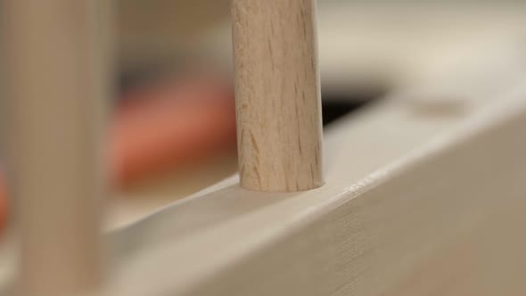 A Wooden Peg is Inserted Into the Hole of the Furniture Product