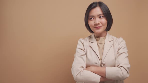 Asian business woman happy smiling show her hands in OK sign language with copy space isolated