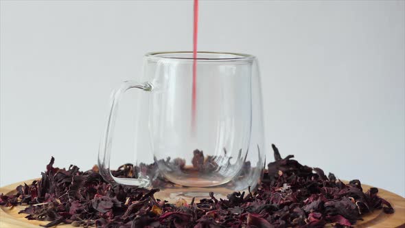 Red Tea in a Glass Cup on a White Background