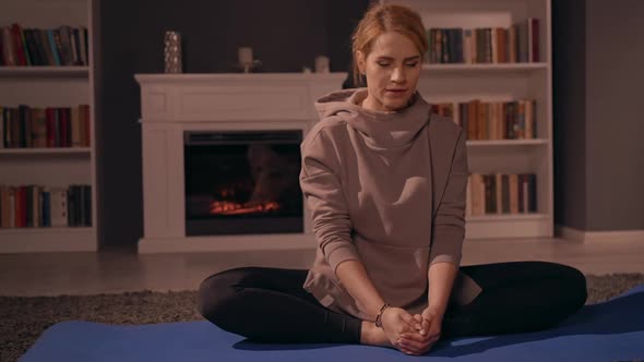 Middle Aged Female Meditate at Home alt