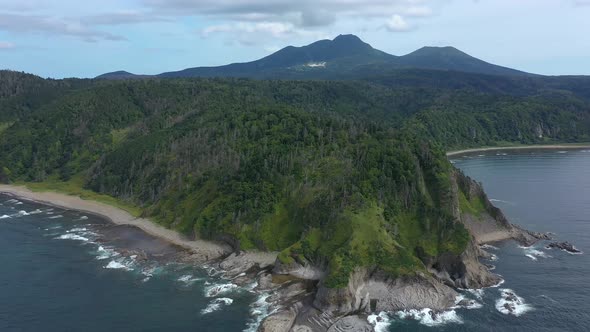 Panoramic View of Cape Stolbchaty and Mendeleev Volcano, Kunashir island, Russia.