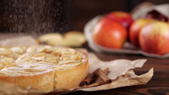 Powdered Sugar Falling on Apple Tart with Cinnamon alt