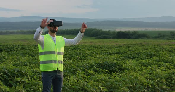 Farm Specialist Engineer Using Technology VR Monitoring Harvest Working for Agriculture Productivity alt