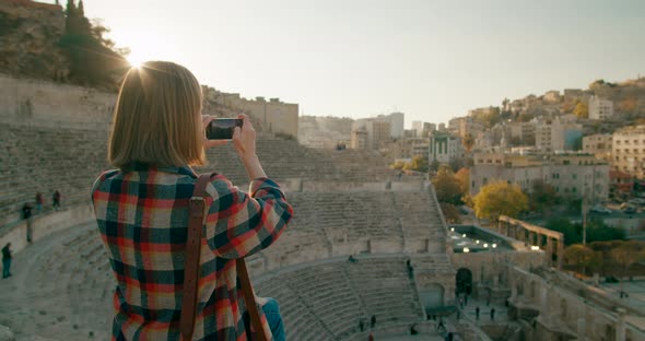 Woman Takes Photo Picture of Landmark Roman Theatre in Amman Capital of Jordan