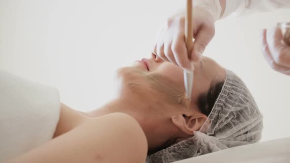 Applying Facial Mask at Woman Face at Beauty Salon