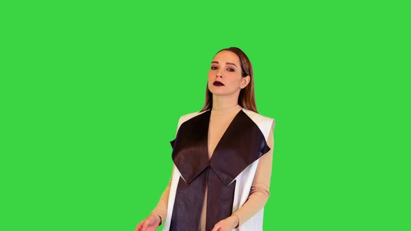 Robotic Girl Appears Points to the Side and Goes Away on a Green Screen Chroma Key