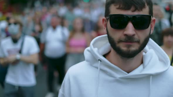 Yelling, shouting rebel protester guy in marching crowd of opposition resistance alt