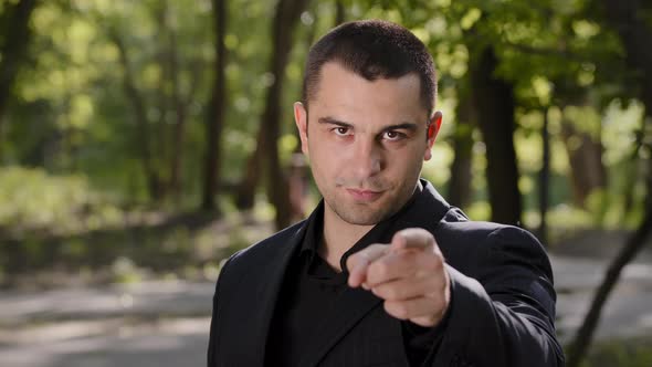 Cheerful Confident Adult Businessman Guy Show Hey you Gesture Points Finger at Camera Make Best alt