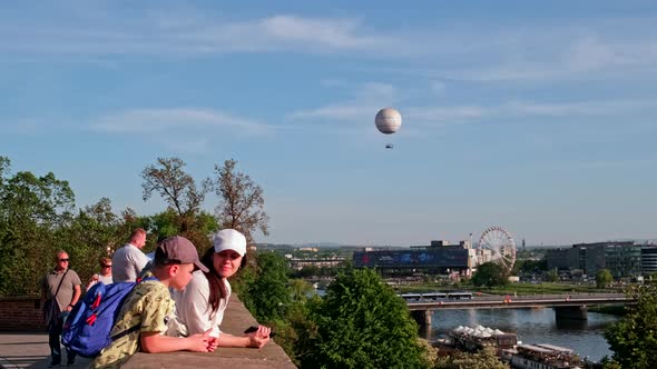Mother with Son Travelers Looking at Panorama of Krakow City alt
