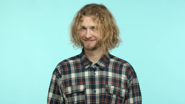 Slow Motion of Funny Blond Man with Wavy Hair and Beard Playing with Eyebrows and Smiling Silly