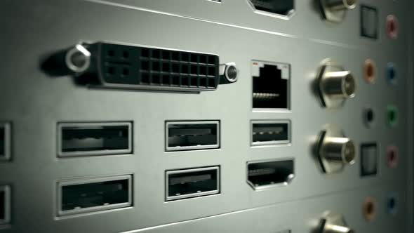 Close-up of PC's backplate. Different slots, outputs and ports. Audio, USB, HDMI alt