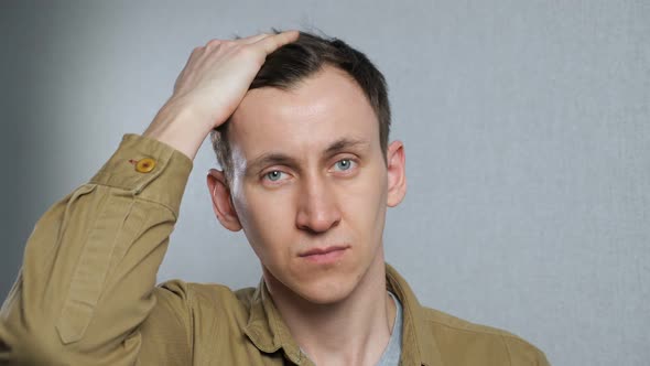 Young Man Worrying About Him Hair alt