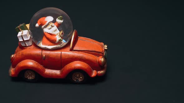 Santa Claus Has Gifts for Everyone a Toy in the Form of a Red Retro Car with a Crystal in Which alt