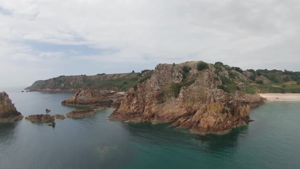 Aerial drone footage of Beauport beach and the surrounding scenery in Jersey. alt