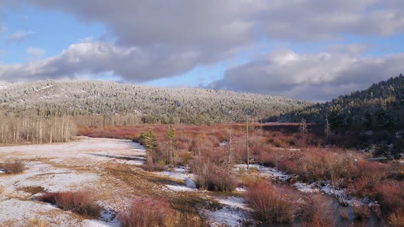 Aerial view flying over colorful snow landscape alt