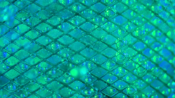 The Flow of Water Directed to the Metal Mesh Causes the Bubbling of Oxygen Bubbles alt