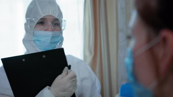 Visit of Doctor, Female Nurse in Protective Suit Mask, Glasses and Gloves Examines Young Girl in alt