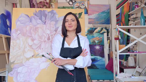 Portrait of Talented Female Artist Wearing Apron alt