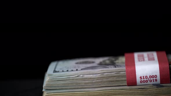 One Hundred Dollar Bills in the Hands of a Girl Redrawing Money alt