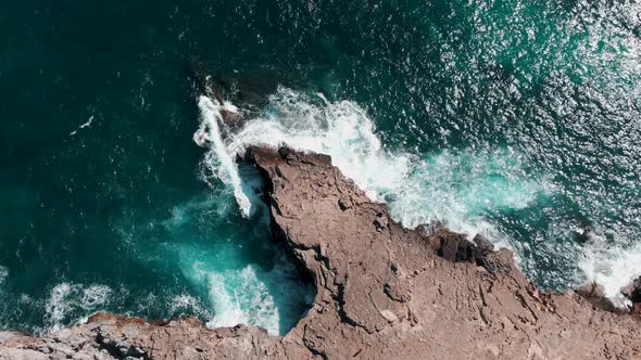 Turquoise Blue Waves Of Mediterranean Sea Splashing On The Rocky Cliffs In Summer At Cala Figuera At alt