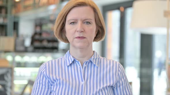 Portrait of Creative Old Woman Shaking Head No alt